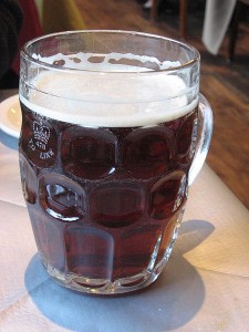 British_dimpled_glass_pint_jug_with_ale